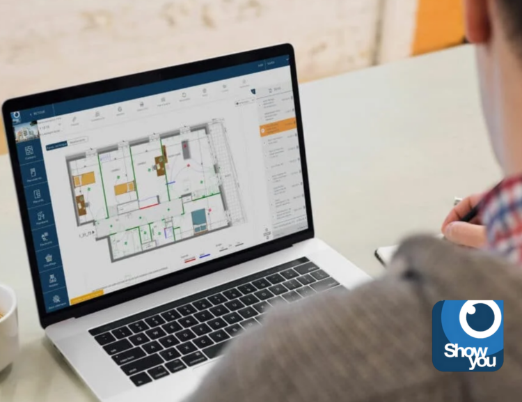 shwo you investissement hand partners: un hommer assis devant un bureau blanc sur lequel se trouve un ordinateur portable et une tasse de café blanche